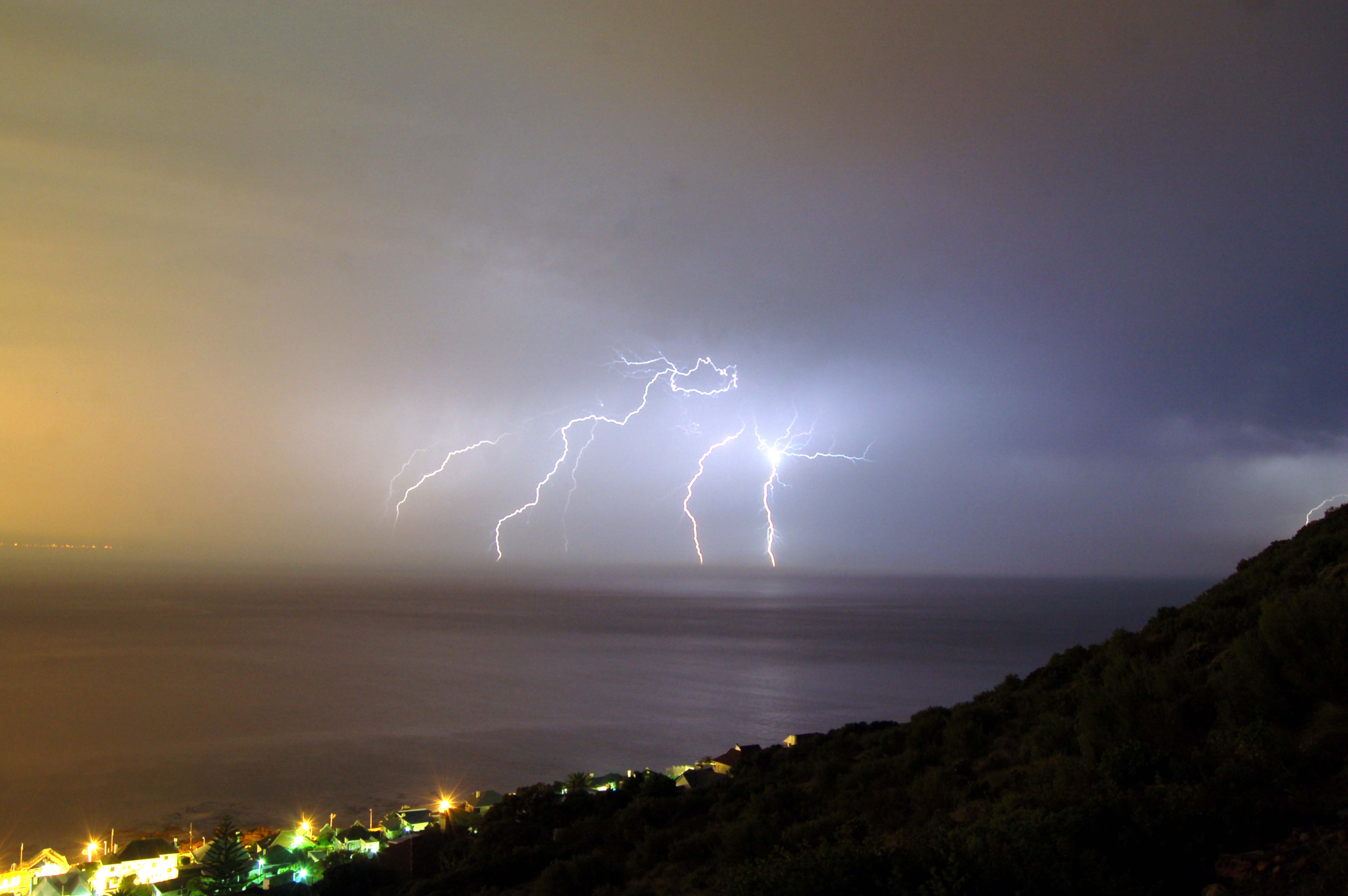 South Africa. Western Cape. Lightening strikes over False Bay in Cape Town.