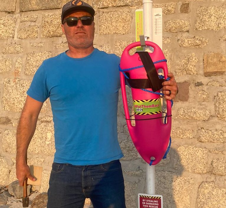 With a lifesaving pink buoy. Image: Craig Bishop