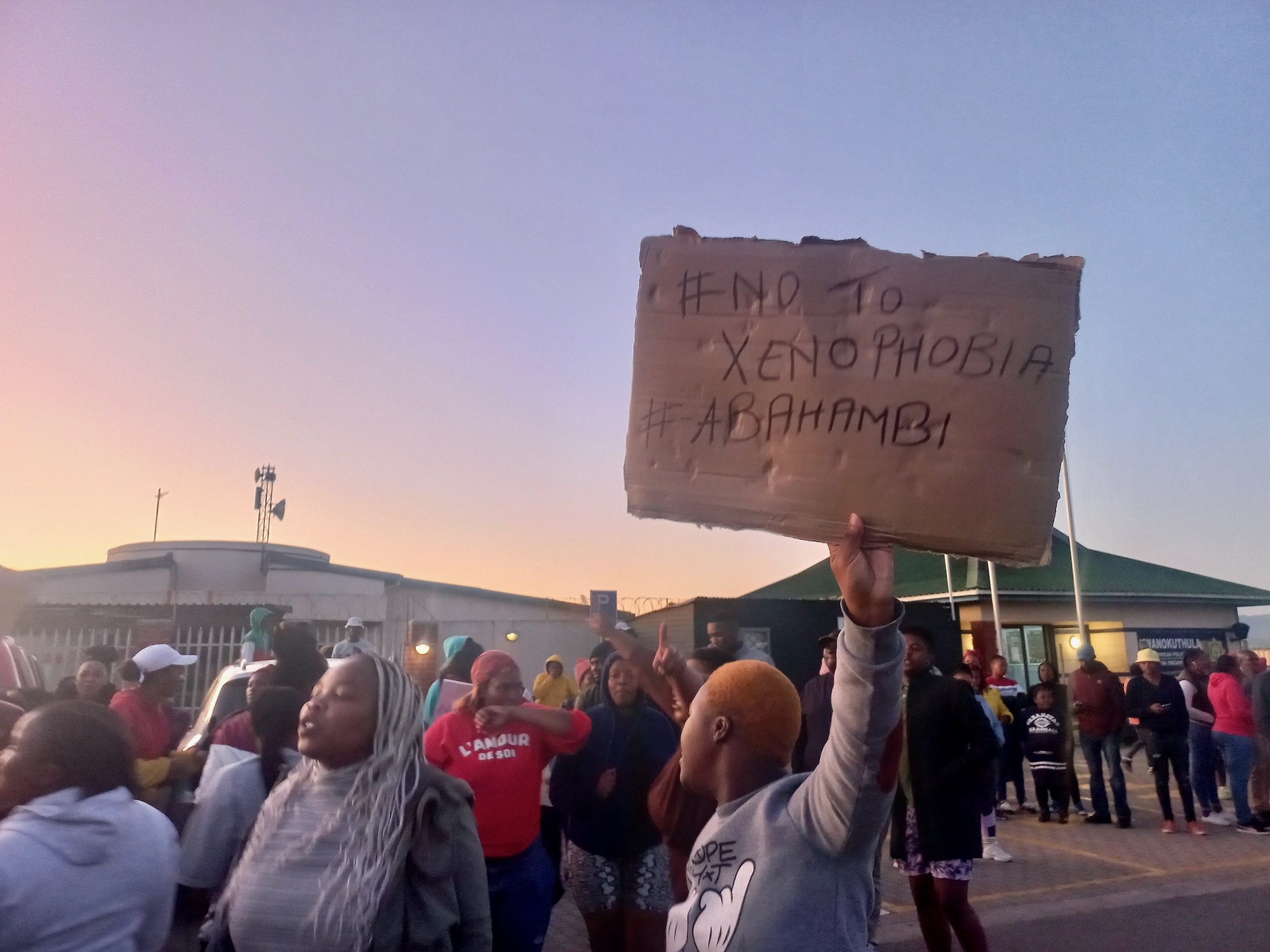 Landlords and some community members protest outside the police station in Plettenberg Bay 
