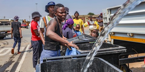 Residents get water from a government truck at Tsakane informal settlement on 21 October 2022 in Tsakane, South Africa. (Photo: Gallo Images / OJ Koloti)