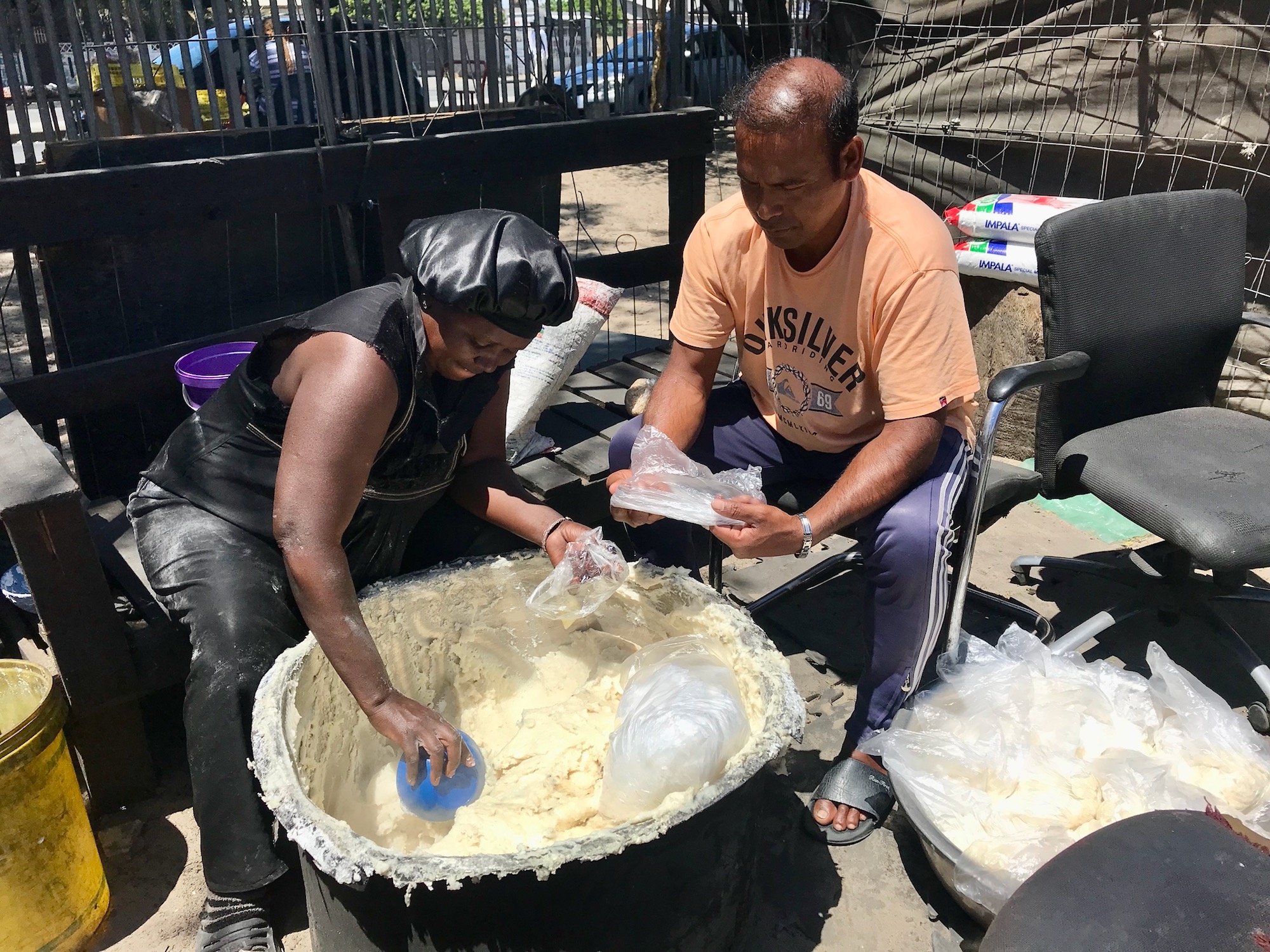 Refugees take turns making food.