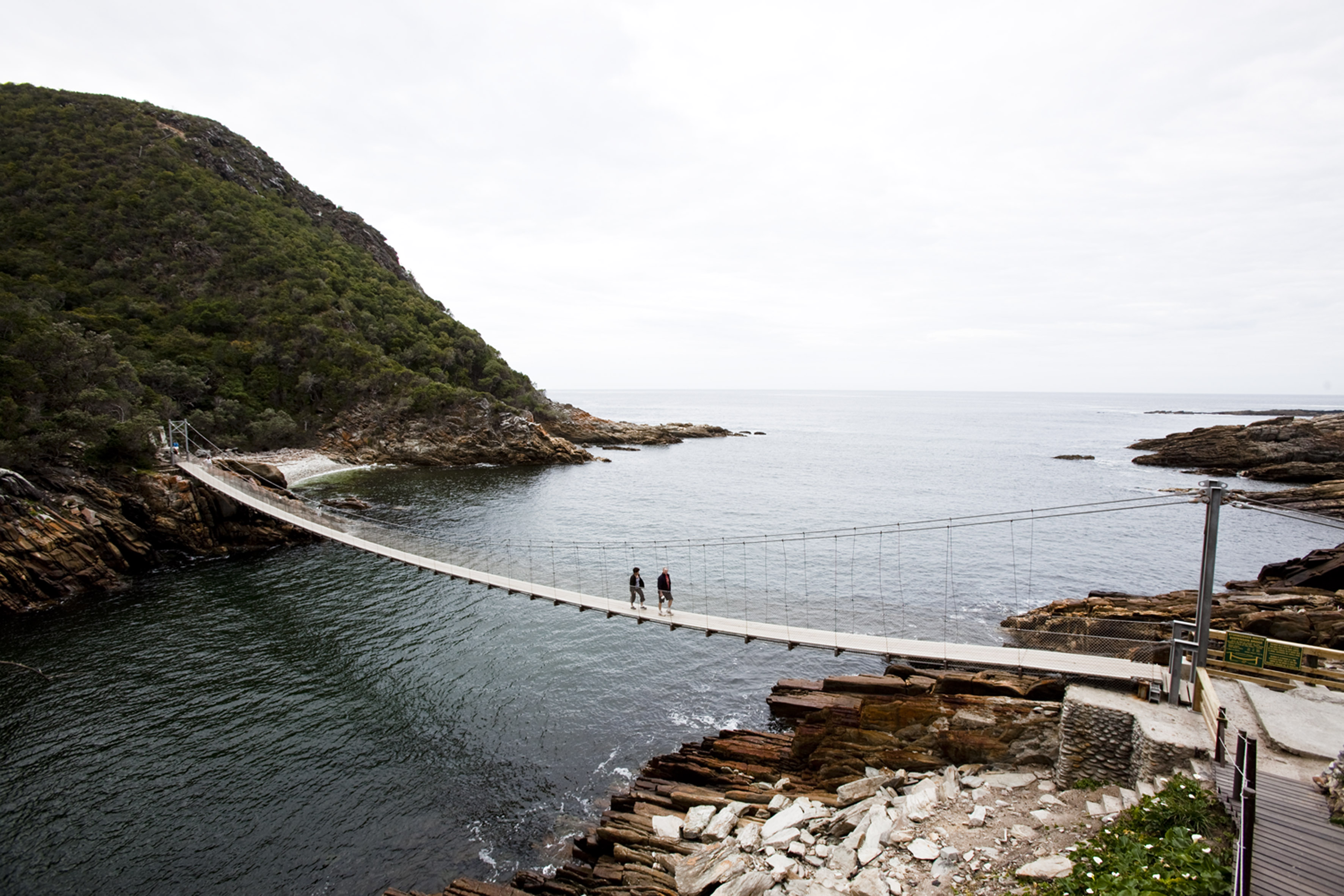 EASTERN CAPE, SOUTH AFRICA - SEPTEMBER 26: A couple walking on the suspension bridge over the Storms River on September 26, 2009 in Eastern Cape, South Africa. (Photo by Gallo Images / GO! / Dawie Verwey)