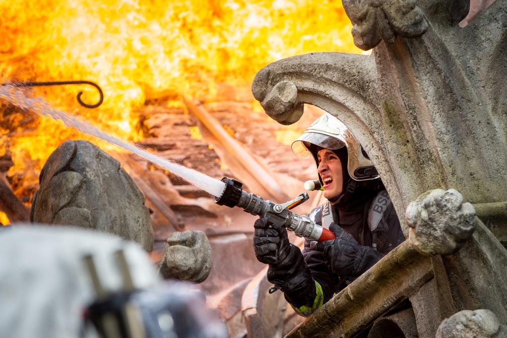 Fireman battles the blaze at Notre-Dame. Production still from 'Notre-Dame On Fire'. Image: courtesy of Universal Studios