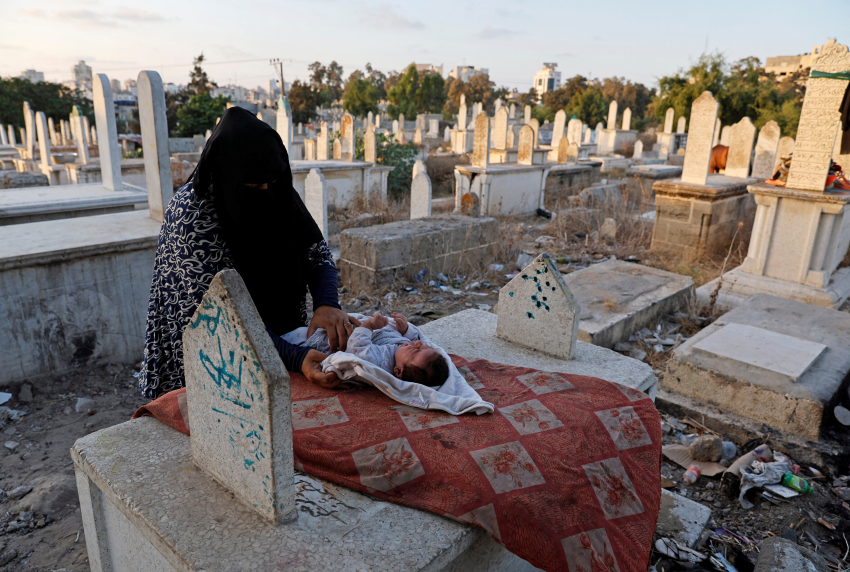 Kamilia Kuhail (35) looks after her 2-month-old son, Ahmed, in Sheikh Shaban cemetery in Gaza City, where she lives with her family. The Kuhail family’s house was built on the graves of two unknown people whose remains are now buried under the foundations. ‘If the dead could talk, they would tell us to get out of here’, says Kamilia. While the authorities grapple with a growing demand for new housing in the densely populated Gaza Strip, a battle for space is pitting the living against the dead, as homeless squatters settle in the area’s cemeteries, The pressure on space in the cemeteries reflects a mounting demographic crisis in Gaza, where the population is set to more than double within the next 30 years. Land is running out and competition for scarce Gaza real estate is understandably fierce, with an ever-increasing demand for both housing and farming land to help feed the growing population. Now, even the dead are affected, as their resting places are pressured by squatters and the relentless realities of a growing population with nowhere else to go. © Mohammed Salem, Palestinian Territory, Occupied, Finalist, Professional competition, Documentary Projects, Sony World Photography Awards 2023