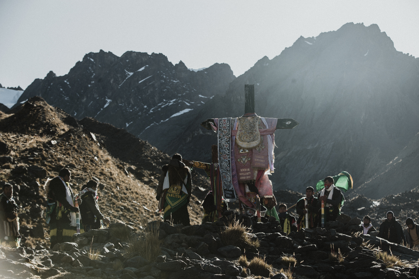 'Inti Alabado'. Members of the Andean nation of Anta pray to the sun and to the cross. These images were captured during a visit to the Andean religious pilgrimage that brings together the Andean nations of the Peruvian region of Cusco. On the slopes of the snow-capped Sinaq’ara mountain, at 4,700 metres (15,400 feet) above sea level, in the district of Ocongate, the people gather to worship the religious image of the Lord of Qoyllur Rit’i and perform rituals to connect with nature and its energy. © Frederick Olivera Gonzales, Peru, Shortlist, Professional competition, Documentary Projects, Sony World Photography Awards 2023