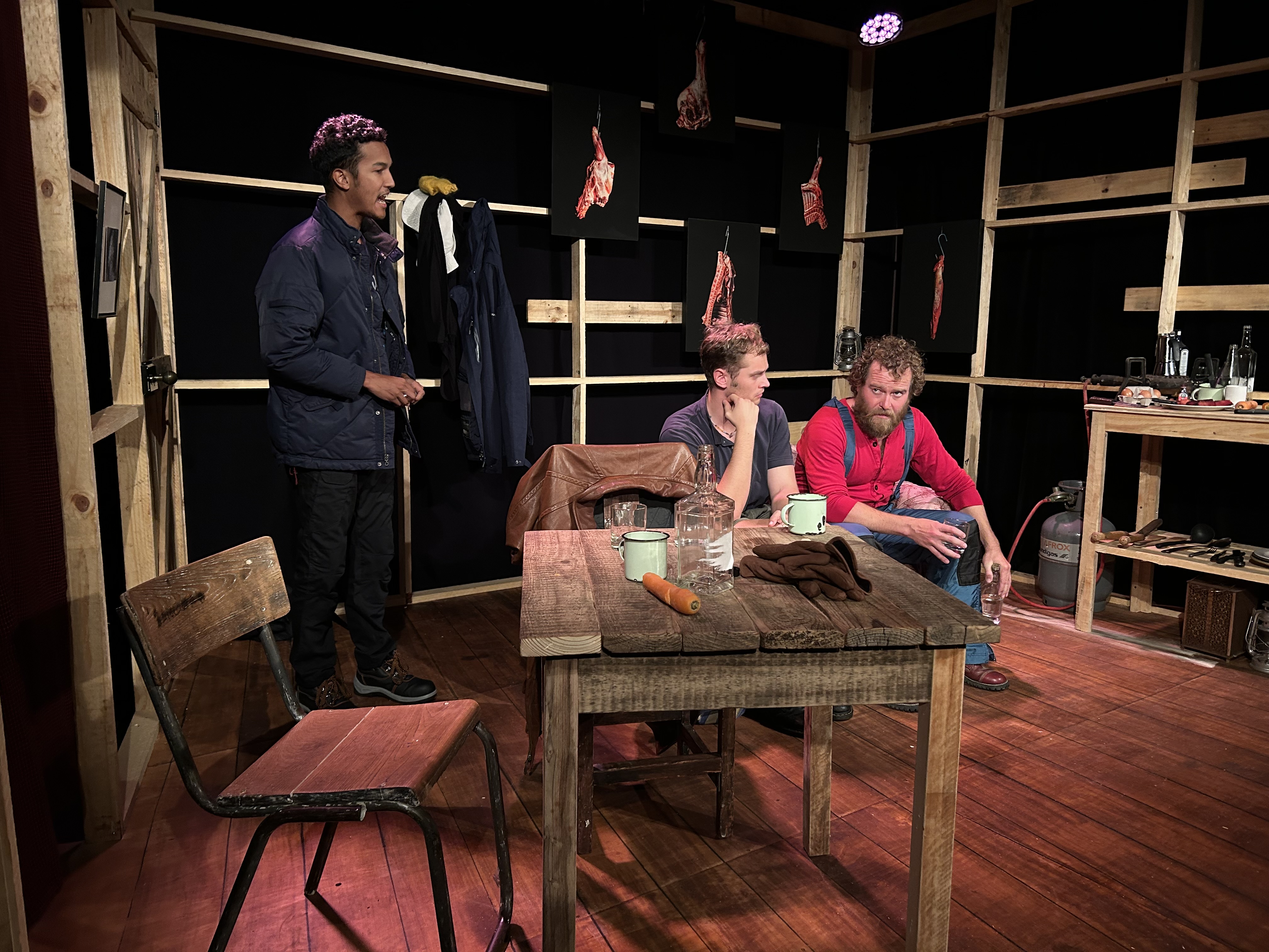 Verbal violence and raw meat – Lyle October (left)_ Aidan Scott (centre) and Nicholas Pauling in 'The Rangers'. Image: Daniel Newton.