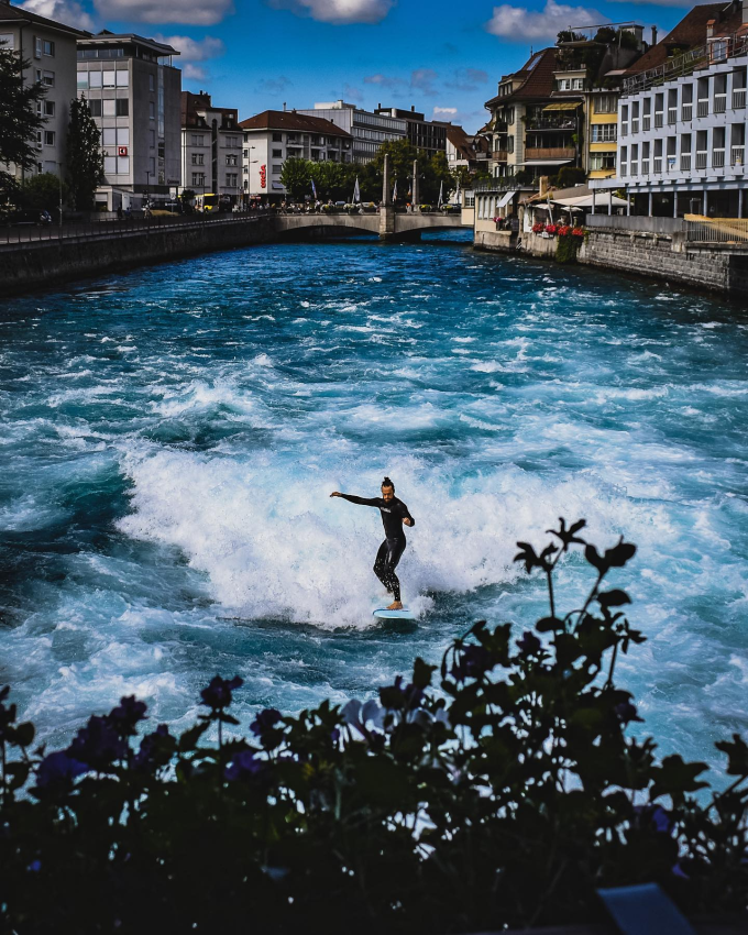 'Surfer in the City'. A surfer in the town of Thun, Switzerland. © Lucian Alexandru Micu, Romania, Shortlist, Open Competition, Street Photography, 2023 Sony World Photography Awards