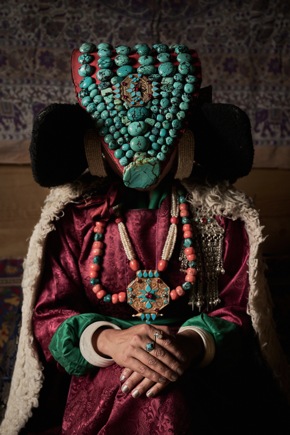 A young Ladakh woman wearing traditional wedding attire, which includes an incredibly elaborate headdress. Decorated with lapis lazuli stones and gold ornaments, these headdresses often weigh more than 15kg. Interestingly, while the bride has a single outfit for the two-day long ceremony, the groom will change outfits more than three times. © Marios Forsos, Greece, Shortlist, Open Competition, Travel, 2023 Sony World Photography Awards 