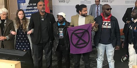 Extinction Rebellion’s Malik Dasoo among climate activists carried out of Electricity Minister’s university lecture
