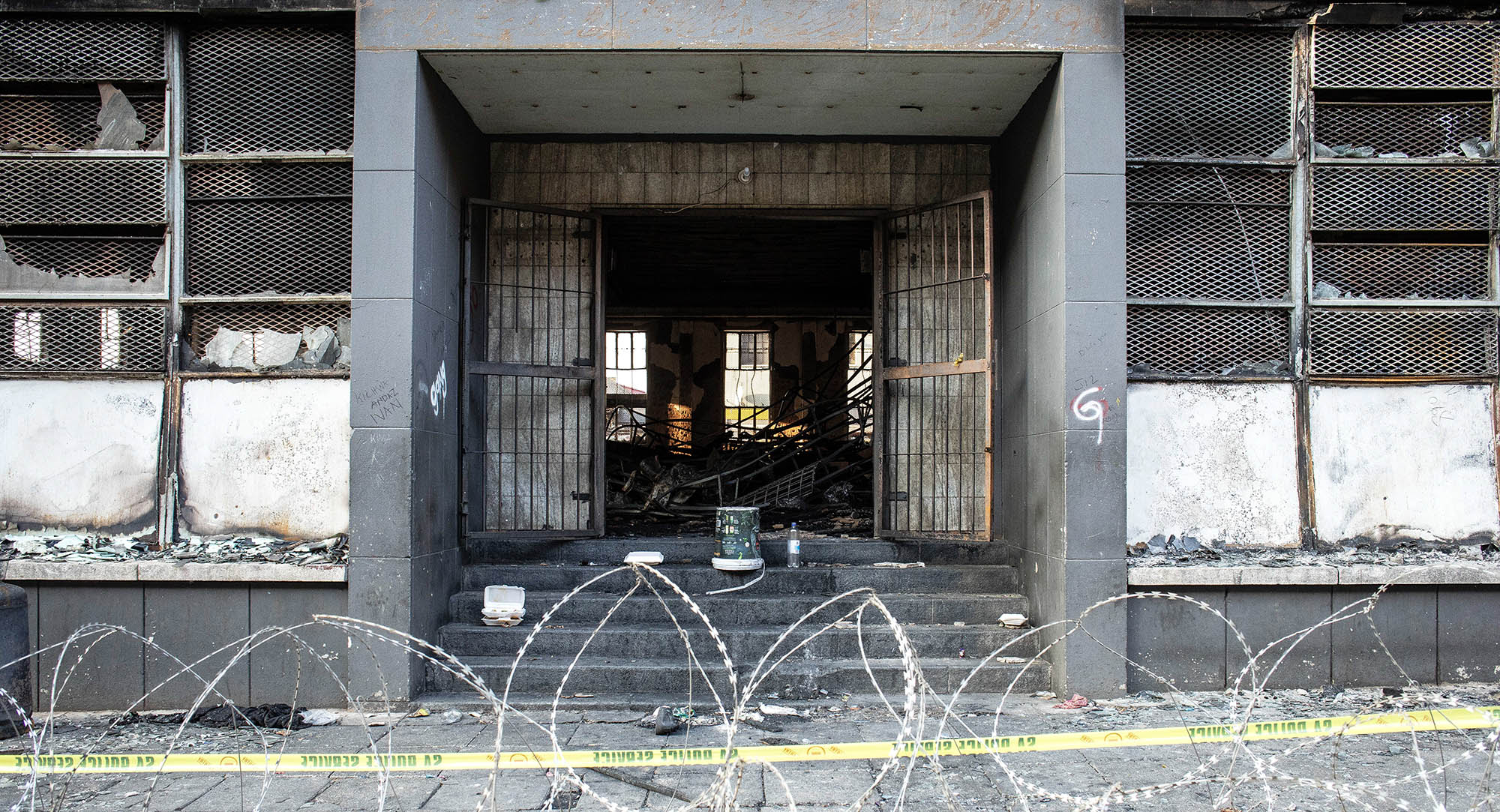 Razor wire surrounds the area in front of the gutted 80 Albert Street building, where at least 73 people died in a fire that broke out in the five-storey building, in downtown Johannesburg
