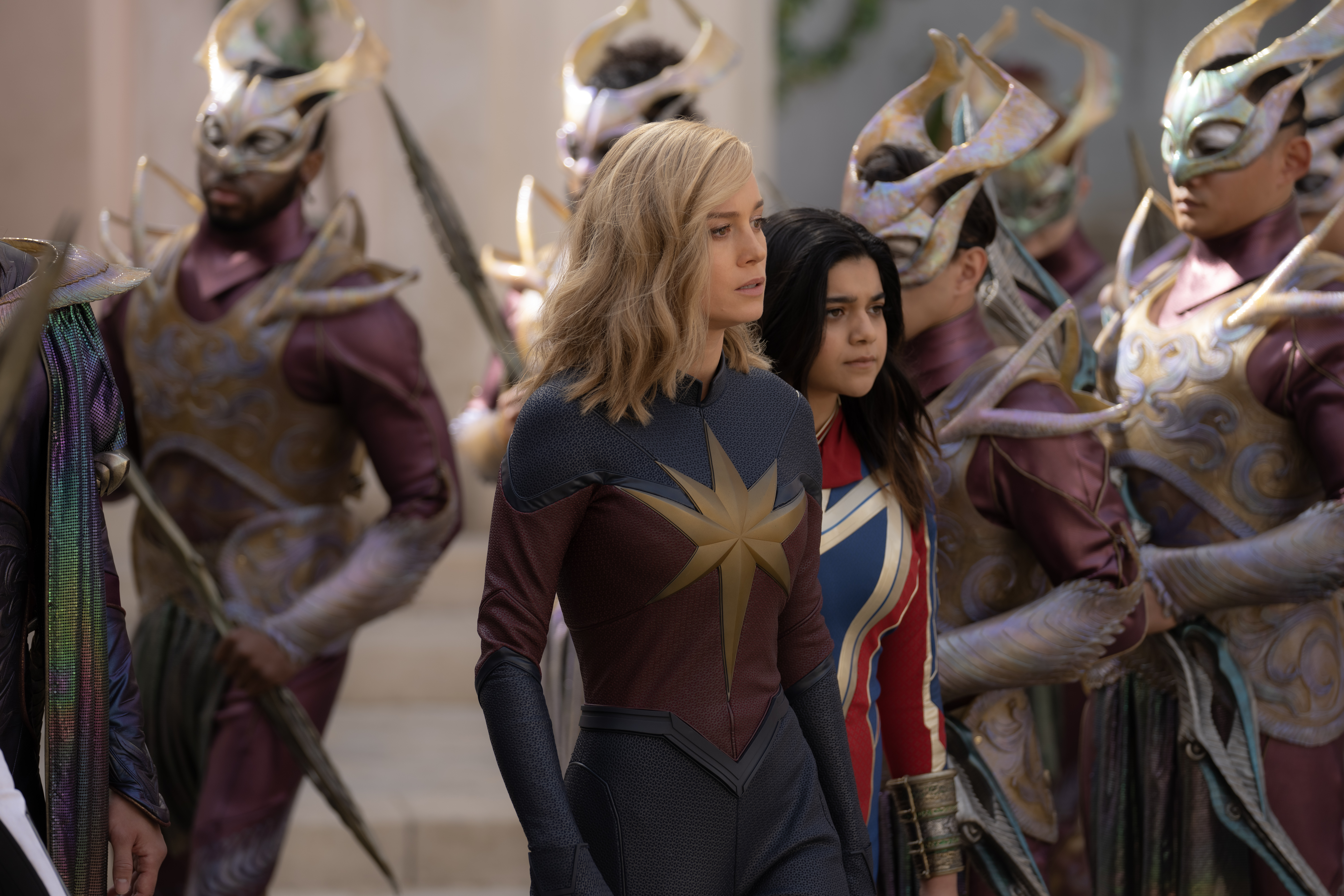 (L-R): Brie Larson as Captain Marvel/Carol Danvers and Iman Vellani as Ms. Marvel/Kamala Khan in Marvel Studios' THE MARVELS. Photo by Laura Radford. © 2023 MARVEL.